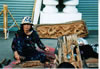 Market lady carving. I bought a big elephant carving from a different vendor. I then had to cary the elephants around for a week.