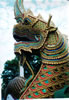 A dragon forming the bottom part of a temple railing.